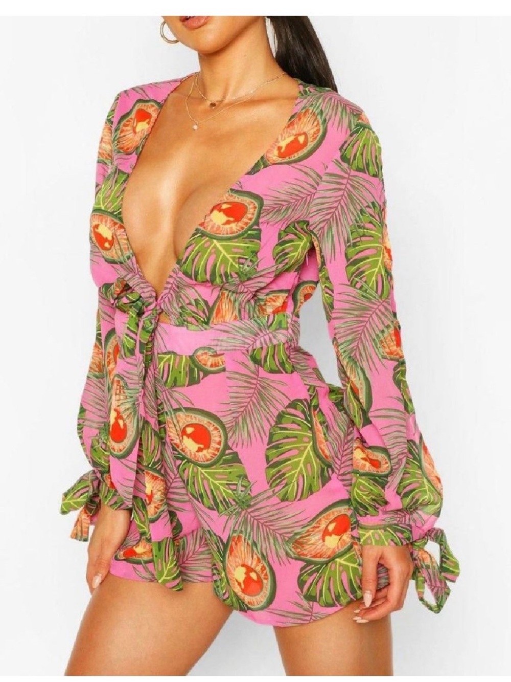 This is a Boohoo pink and green tropical print tie-front beach cover-up romper